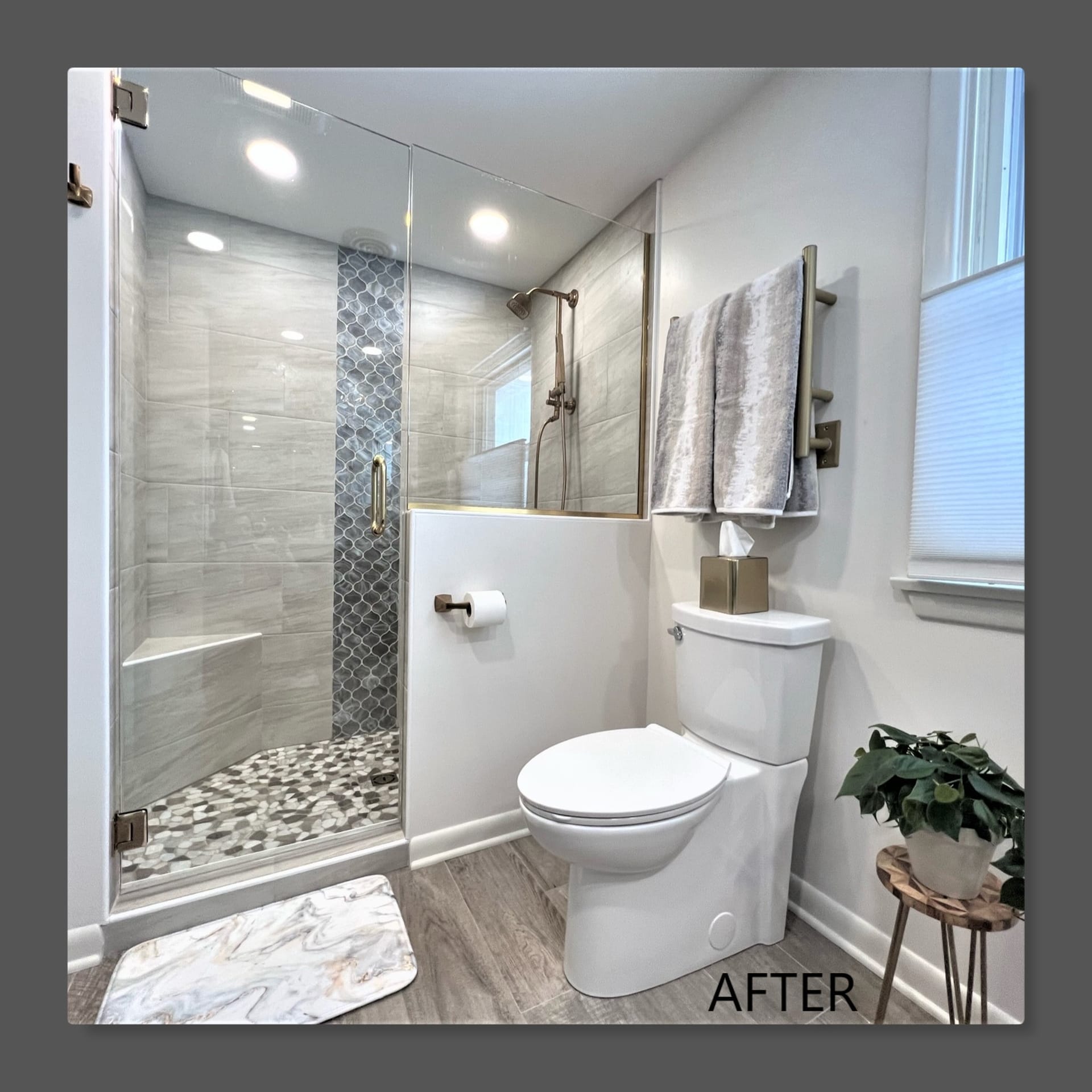 Bathroom with glass tile shower, vertical mosaic accent strip, pebble shower floor, bench seat, and wood-look plank flooring