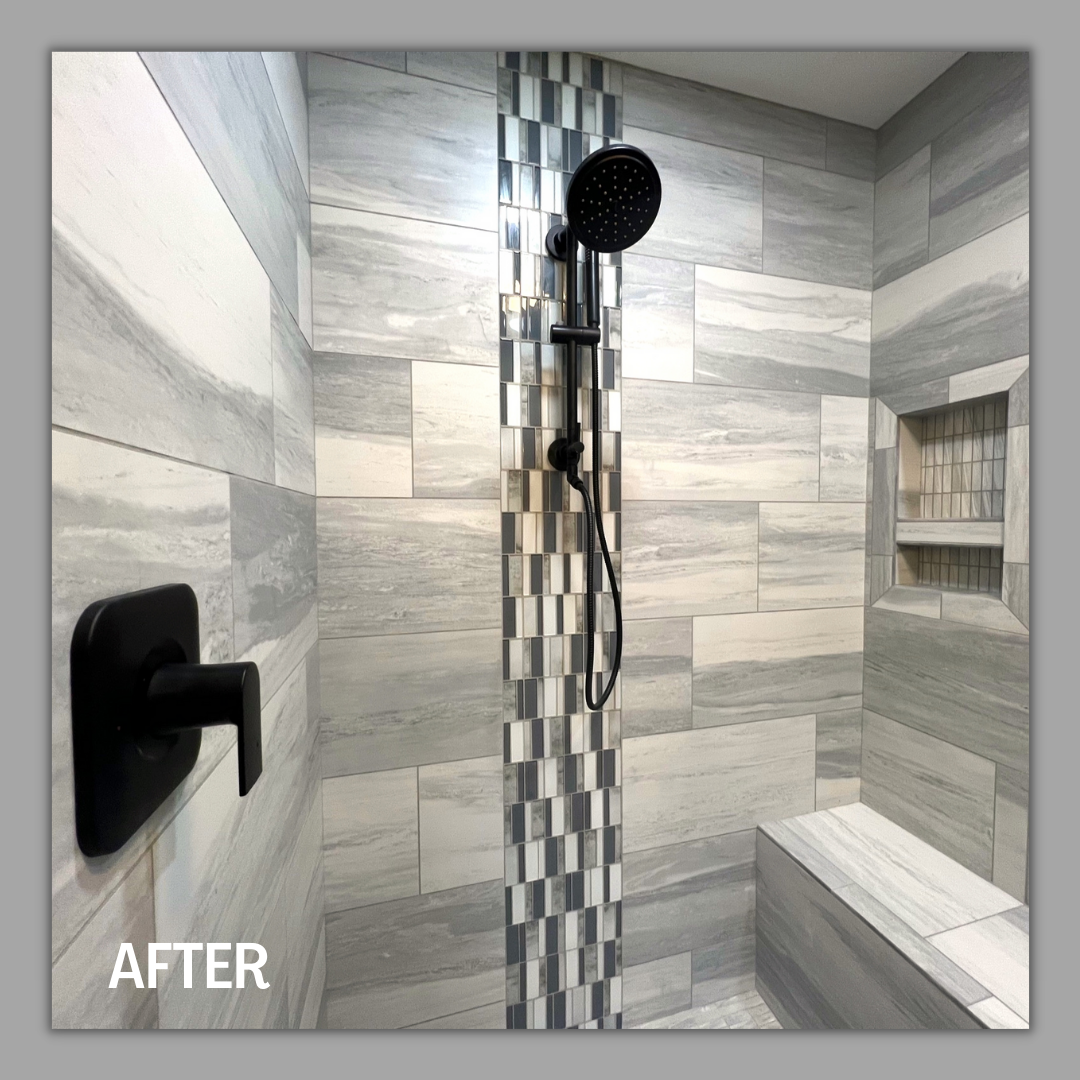 Grey marble-look tile shower with vertical glass mosaic strip, matte black fixtures, recessed niche, and bench, Erie PA