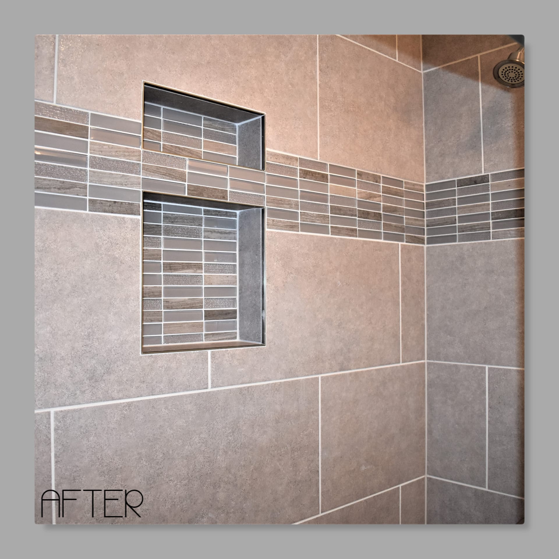 Tile shower with grey tile walls, linear glass mosaic accent band, and recessed double niche