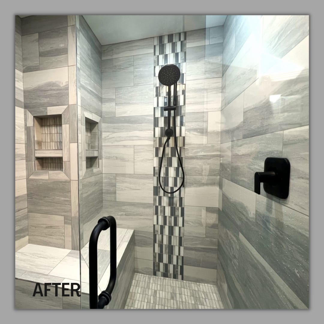 Glass tile shower with grey marble-look tile, brick mosaic accent column, matte-black showers, tile bench, and double niche