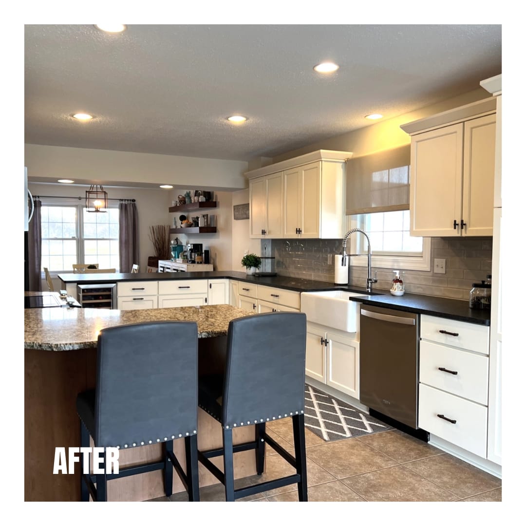Cream shaker kitchen with grey subway tile, apron farmhouse sink, granite peninsula, and blue upholstered barstools, Erie PA