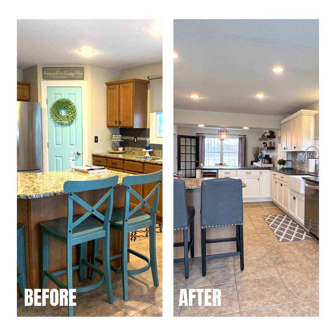 White shaker kitchen with dark counters, apron farmhouse sink, tin-look backsplash, floating wood shelves, and tan tile flooring