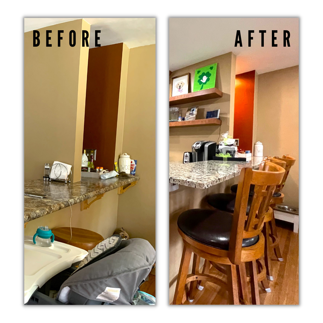 Granite breakfast bar peninsula with wood swivel barstools, floating shelves, red accent nook, and hardwood flooring, Erie PA